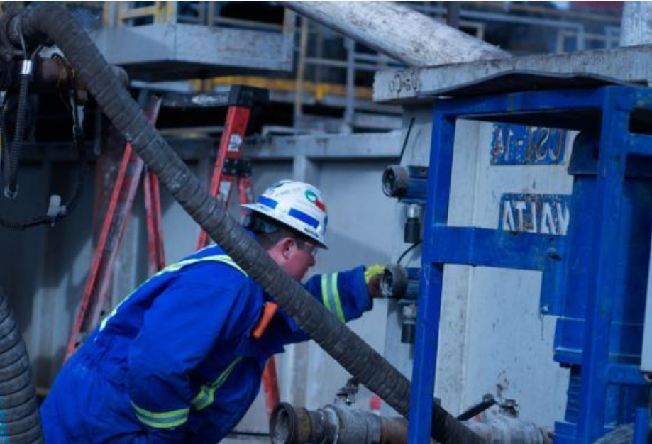 A worker inspecting an element of the job site